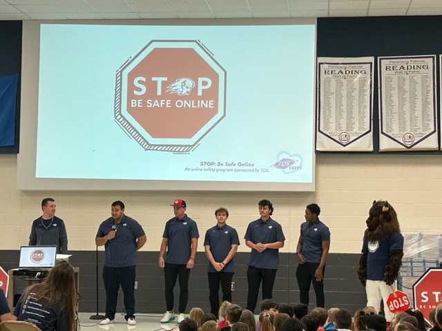 Utah Tech football players and bison for the online safety assembly.