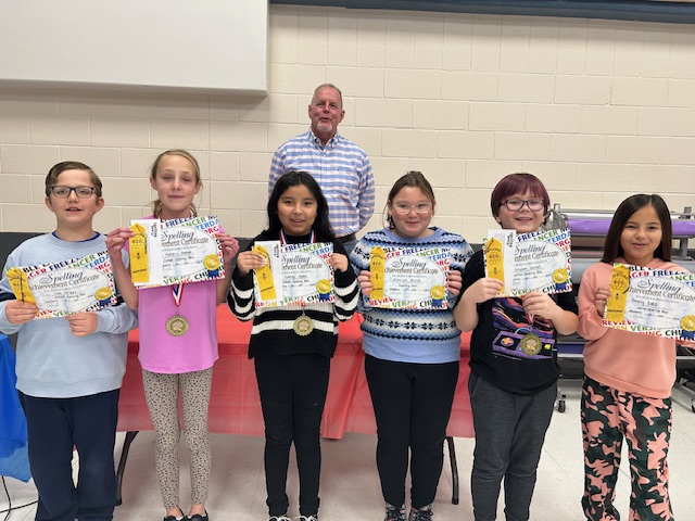 Six School Spelling Bee winners with Mr. Barrett Principal