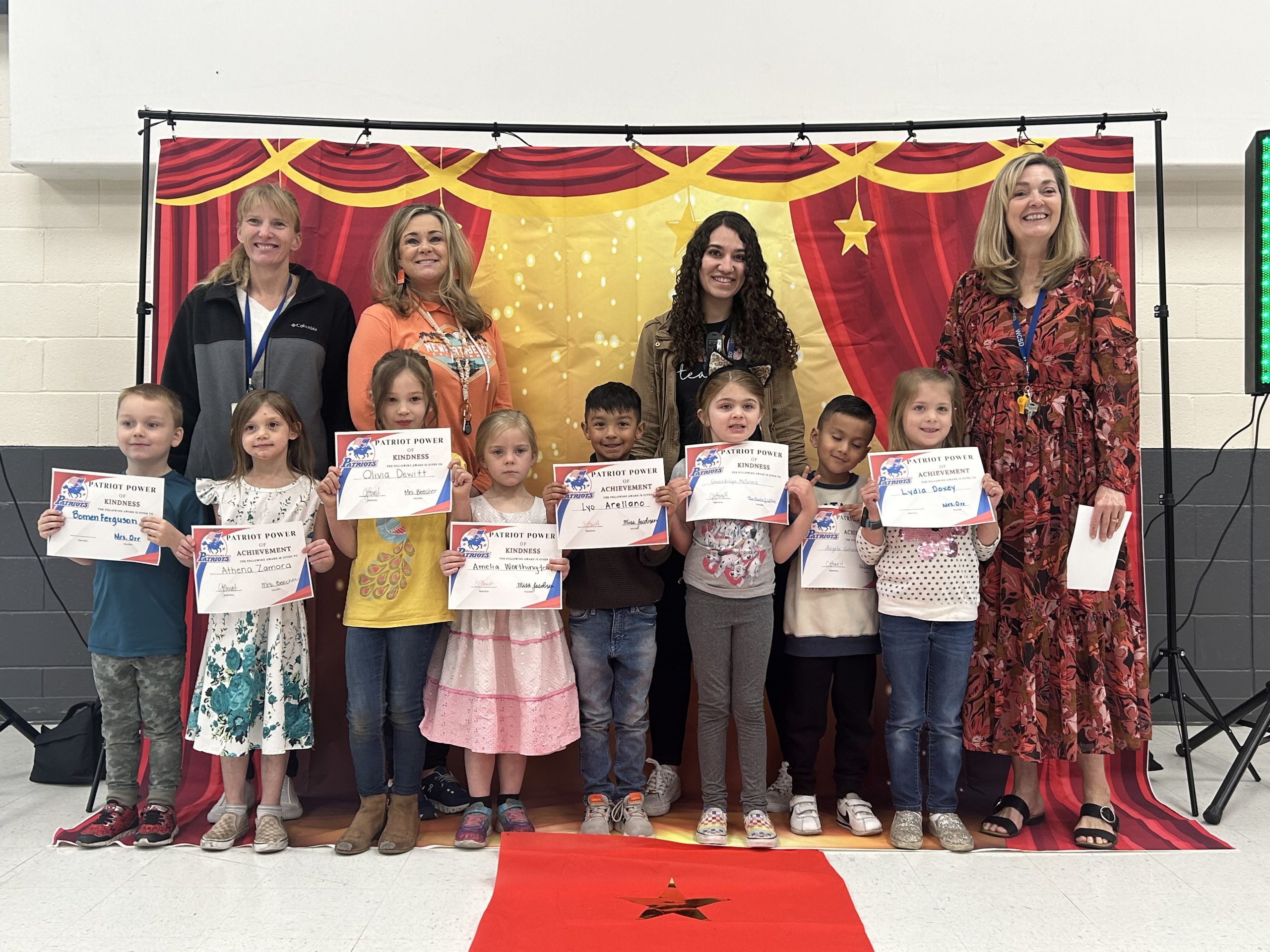 Kindergarten teachers and students posing for the Patriot Power Reward Assembly