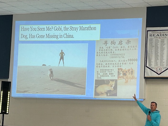 Pictures of Gobi and Dion in the desert, and a sign in Chinese. A picture caption that says, "Have you seen me? Gobi, the stray marathon dog, has gone missing in China."