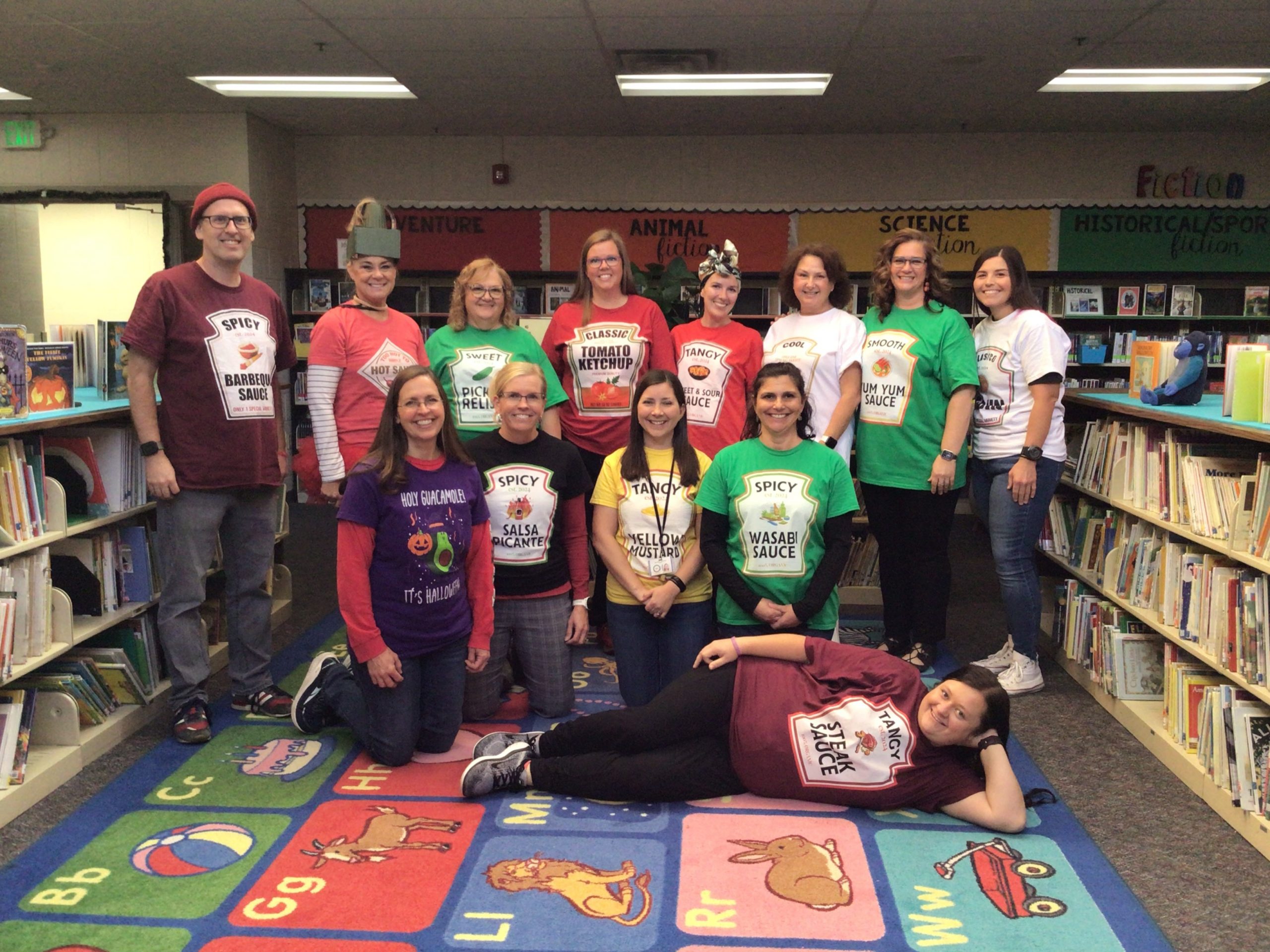 Teachers posing in their Halloween Costumes.