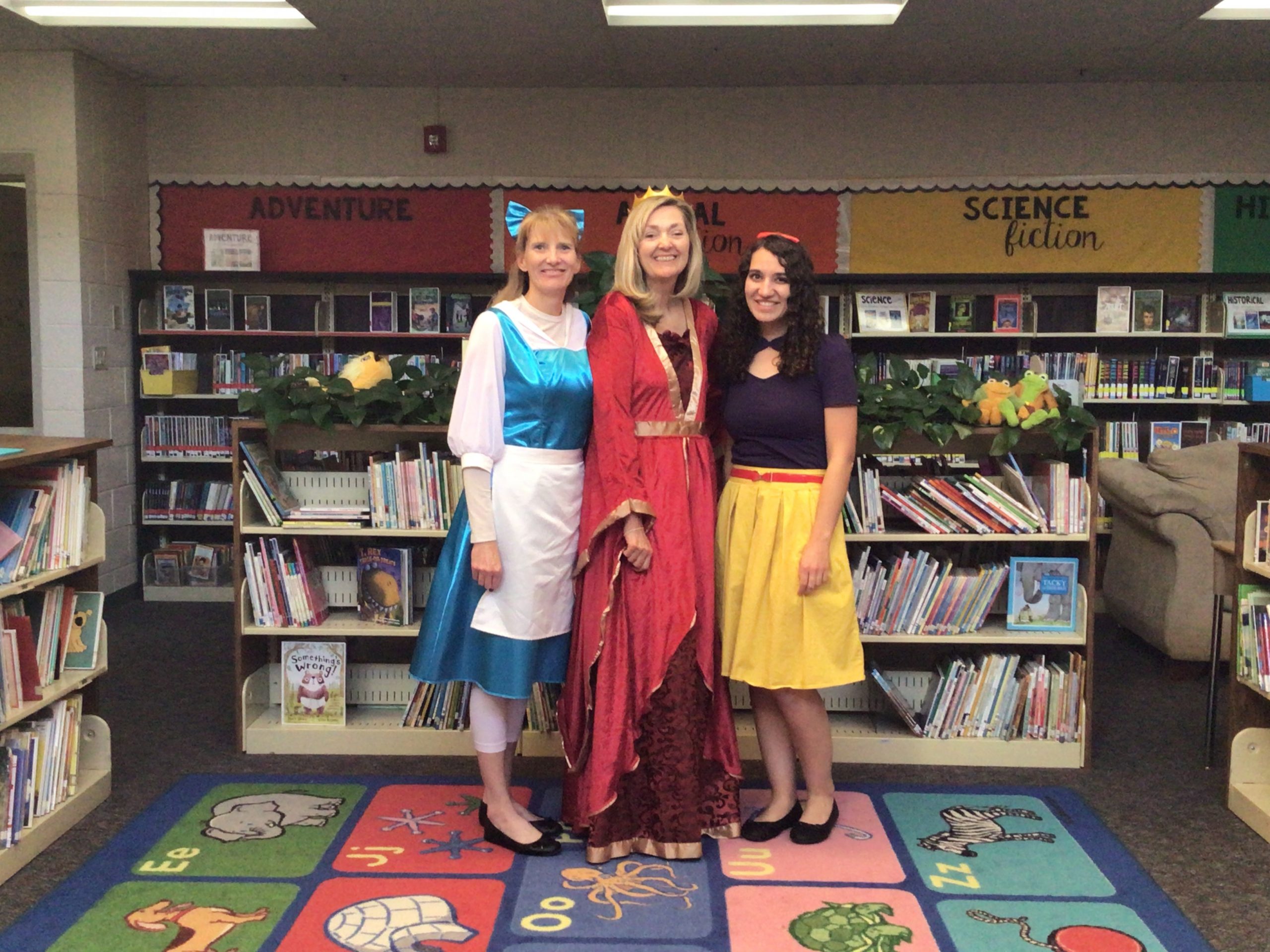 Kindergarten teachers posing in their Halloween costumes.