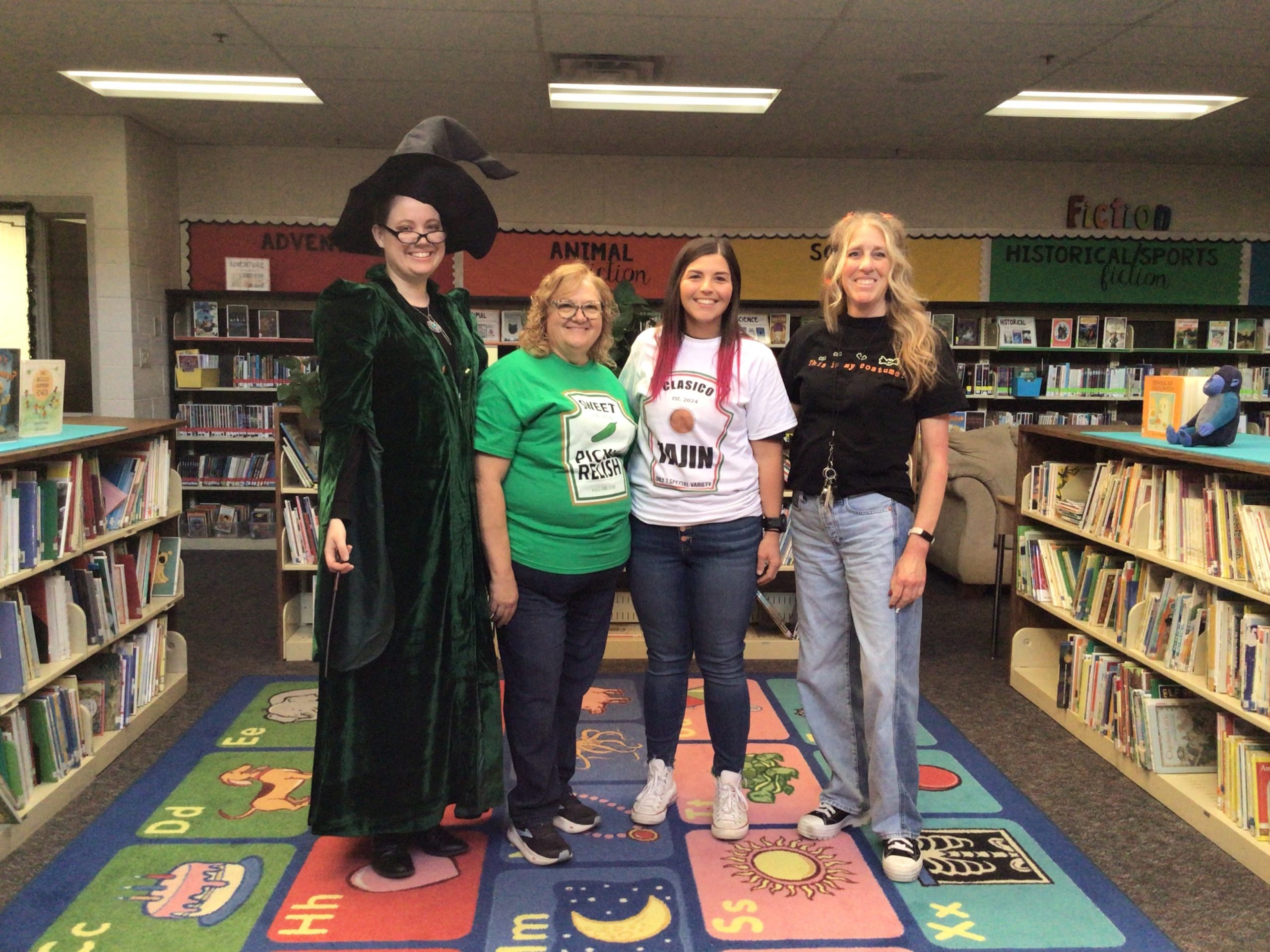 Third grade teachers posing with Halloween costumes.