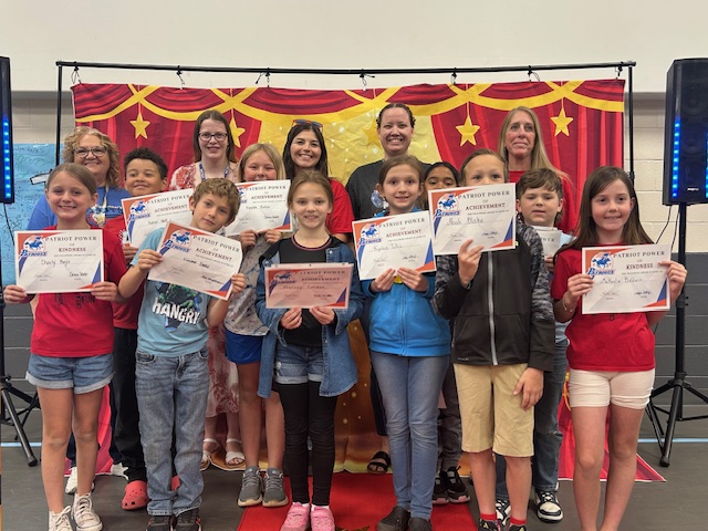 Third grade teachers and students posing for the Patriot Power awards for kindness and achievement.